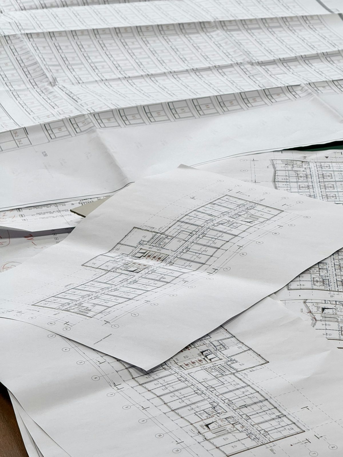 Renovation floor plans and drawings laid out on a table