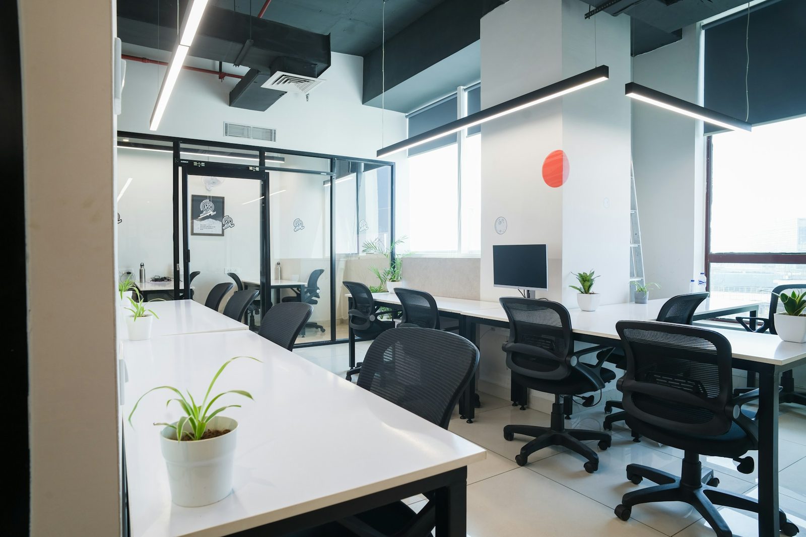 Modern open-plan office fit-out with timber desks and glass partitions